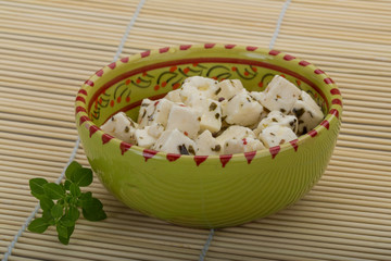 Cheese with spices and oil