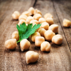 Fresh Prepared Chickpeas over rustic wooden table close up.