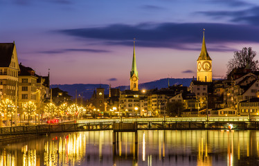 Zurich on banks of Limmat river on a winter evening - obrazy, fototapety, plakaty