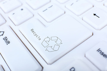 Recycle concept, close up of keyboard, recycle button