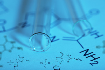 Test tubes and reaction formula, close-up