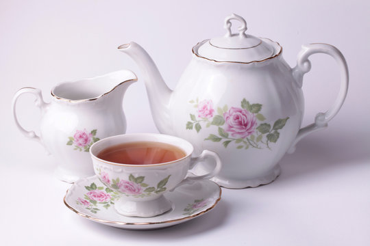Traditional english tea with white tea set floral dishware