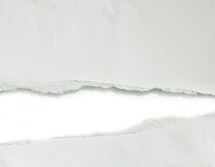 Hole ripped in paper. Copy space