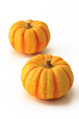 Yellow pumpkin on the white background