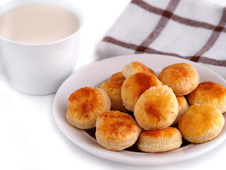 Homemade cheese cookies and cup of milk