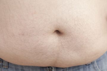 Fat man with a big belly, close-up part of the body