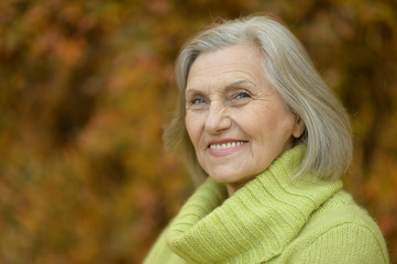 Senior woman in autumn park