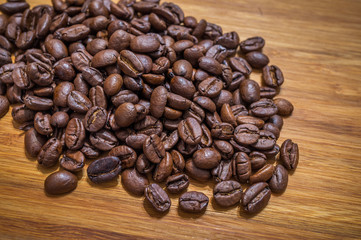 Coffee beans on wooden table