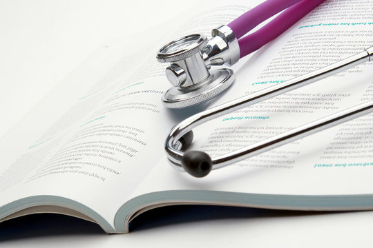 A Medical Stethoscope On An Open Book, Closeup