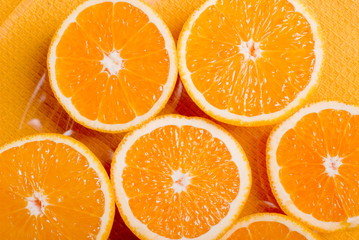 sliced ripe appetizing orange to yellow napkin