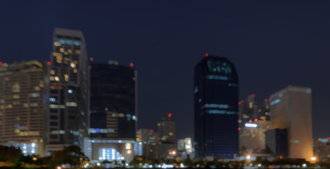 Fototapeta na wymiar City skyline at night - Blurred bokeh background