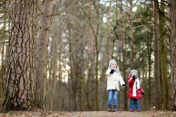 Fototapeta premium Two little sisters having fun together