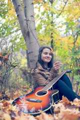 Happy woman playing with a leaf