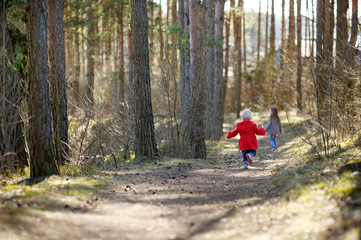 Obraz premium Two little sisters having fun together