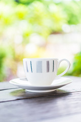 Fototapeta na wymiar Coffee cup on wooden table