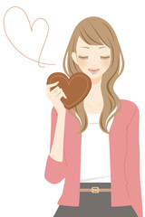 ハート型のチョコを持った女性　笑顔