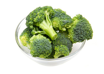 Broccoli in glass bowl on white background