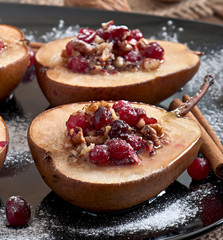 Baked pears with cranberries, honey and walnuts