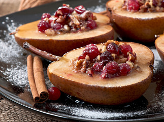 Baked pears with cranberries, honey and walnuts