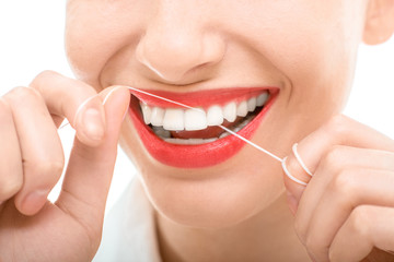 Naklejka premium Woman flossing teeth