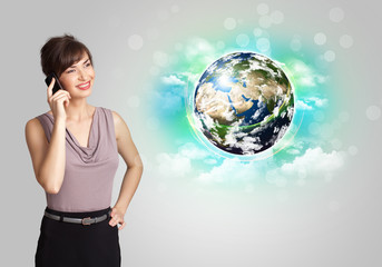 Young woman with earth and cloud concept