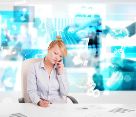 Business person at desk with modern tech images at background