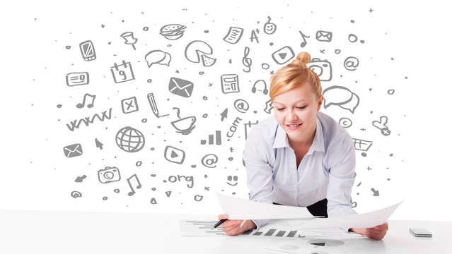 Young businesswoman with all kind of hand-drawn media icons in b