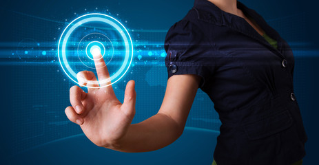 Woman pressing high tech type of modern buttons