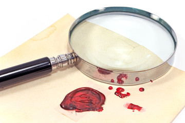 Antique magnifying glass on wax sealed letter