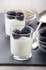 blackberries and yogurt in a shot glass