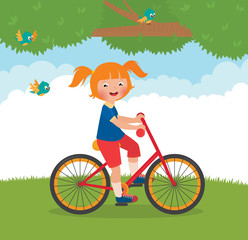 Joyful child rides a bike