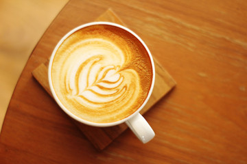 close up hot latte on wooden table
