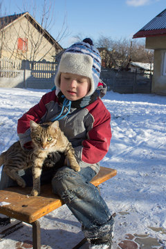 boy sitting on sled