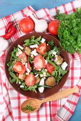 Eggplant salad with tomatoes, arugula and feta cheese,