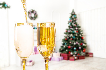 Two Champagne Glasses On Defocused Background Living Room