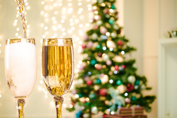 Two Champagne Glasses On Defocused Background Living Room