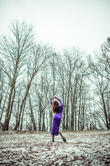 Young pretty sexy girl in dress outdoor in the forest