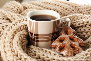 Cup of tea with cookies on table close-up