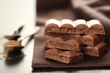 Tasty porous chocolate on table, close up