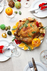 Baked chicken for festive dinner. Christmas table setting