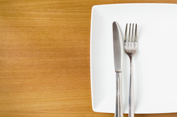 White place setting on a  wooden table