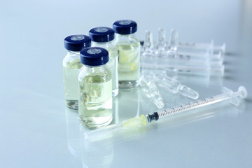 Vaccine in vial with syringe