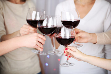 Woman hands with glasses of wine close-up