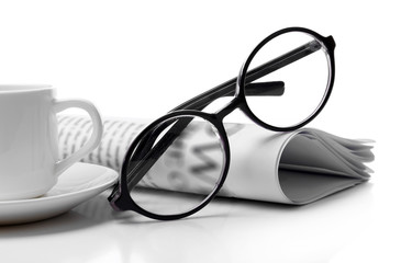 Glasses and newspapers, isolated on white