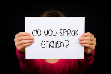 Child holding Do You Speak English sign