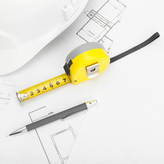 Helmet with pencil and measure tape