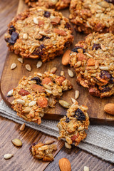 Obraz na płótnie Canvas Homemade oatmeal cookies with seeds and raisin
