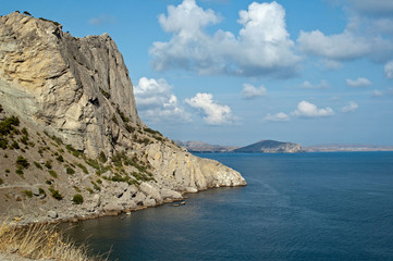 Sea landscape with rocks and clouds