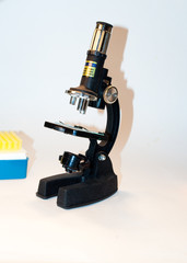 Black microscope on a white background.