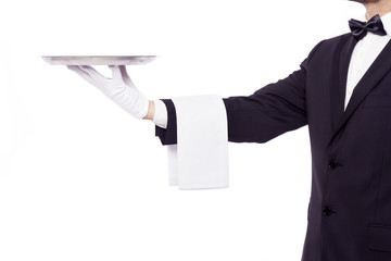 Waiter holding an empty silver tray over white background